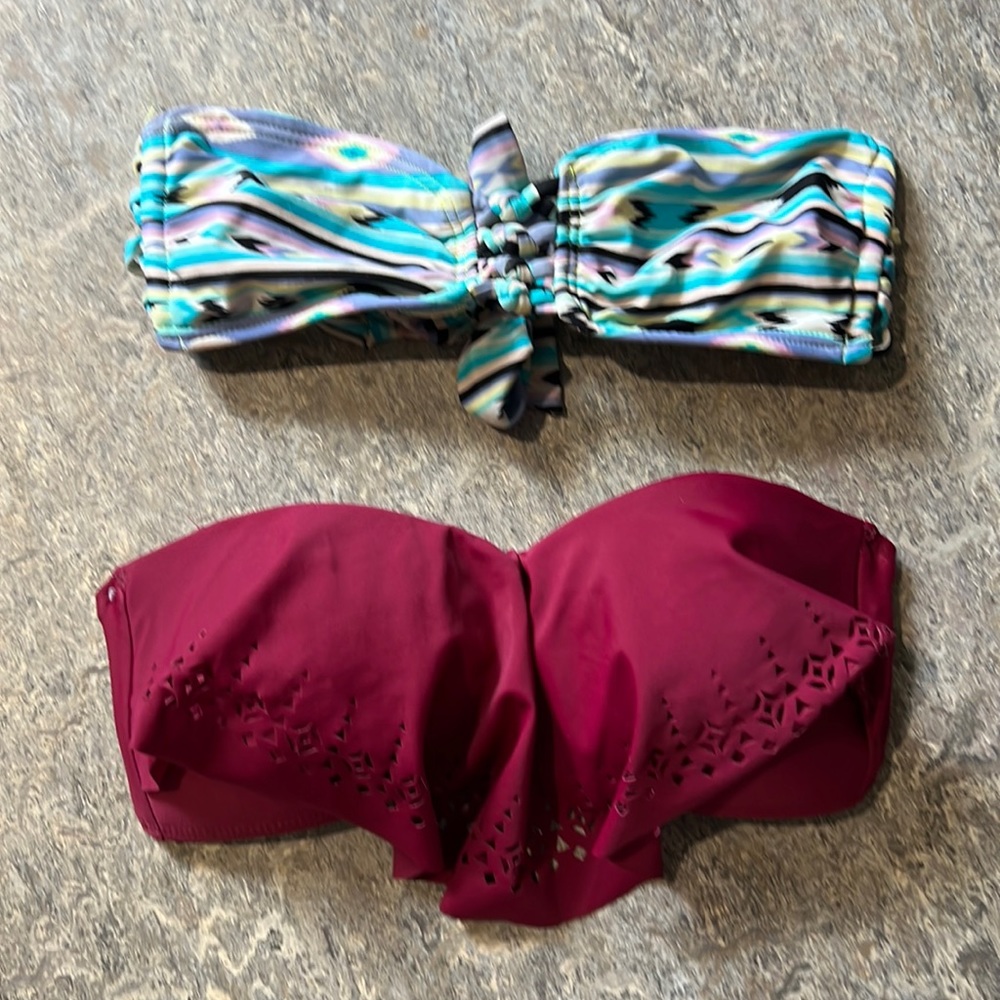 Two strapless swimsuit tops, both size small.